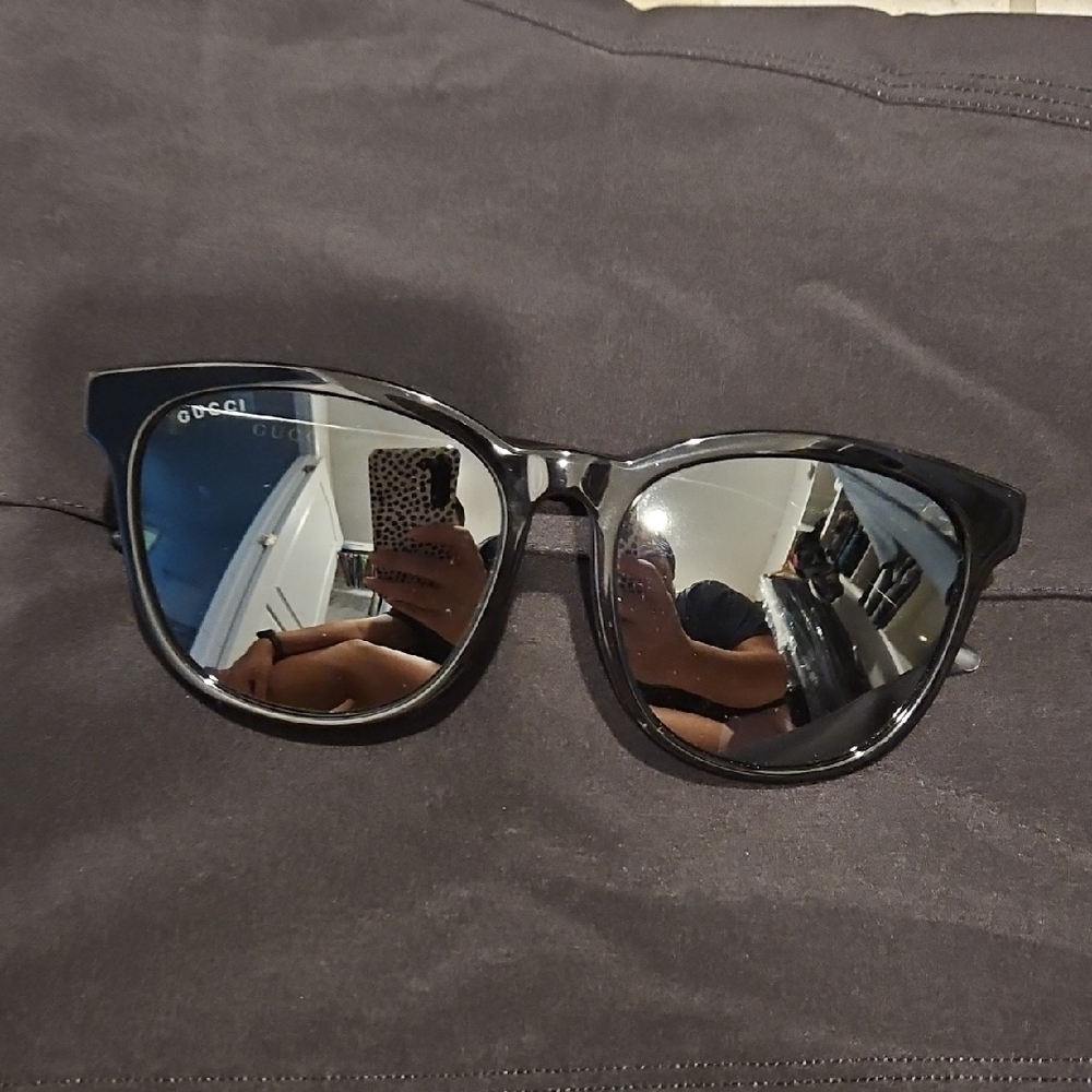 Gucci Black Frame Sunglasses with Reflective Silver Lenses